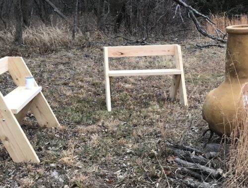 Chimenea and two benches on the edge of the woods