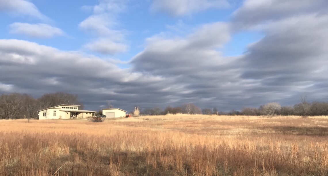 House on the prairie under brilliant blue sky
