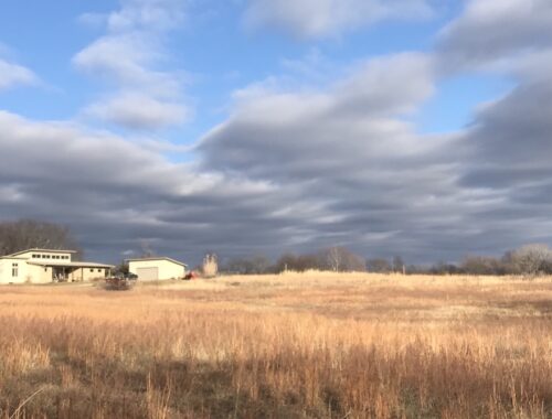 House on the prairie under brilliant blue sky