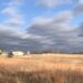 House on the prairie under brilliant blue sky